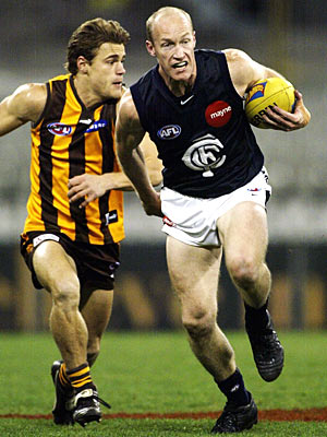 Andrew McKay sprints away from Hawthorn's Brett Johnson.