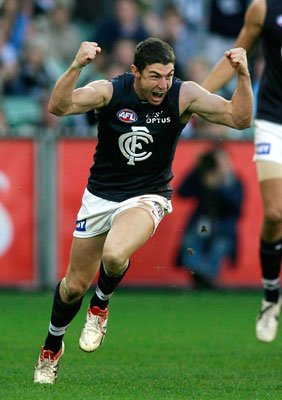 Simon Wiggins celebrates kicking the winning goal against Collingwood.