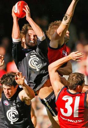 Brad Fisher taking a strong pack mark against Melbourne