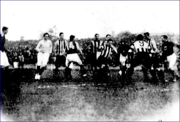 1913 Rnd 4 v Collingwood at Victoria Park
Poss. Martin Gotz far left, umpire Letcher, No.14 Billy Dick, Paddy O'Brien (in sleeveless guernsey, behind opponent), poss. Tom Clancy far right. 
Trove; Australasian May 24