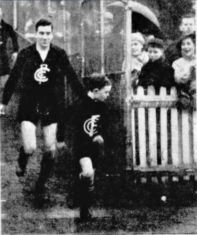 1936 Rnd 12 v Fitzroy Jim Francis and Kevin Howard (mascot)
Trove; Herald July 25 (p40)