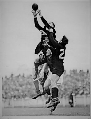 1937 Rnd 14 v Melbourne
Pat Farrelly soars over Long and Chambers (Melb) and team-mate Jack Wrout.
B&W enhanced photo
original image info from (Trove) Herald July 24 p13 